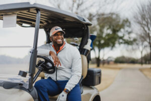 charles dillahunt in a golf cart